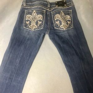 Miss Me pre-washed denim jeans.